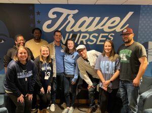 Travel Nurses, Inc. staff with Albert Hutson, SPT (pictured in a white hat) in the TNI Grizzlies' suite. 