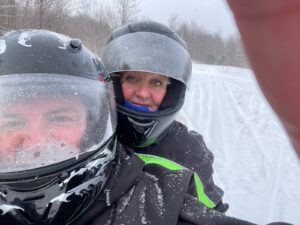 Christina Dwyer, RN on a snowmobile. 